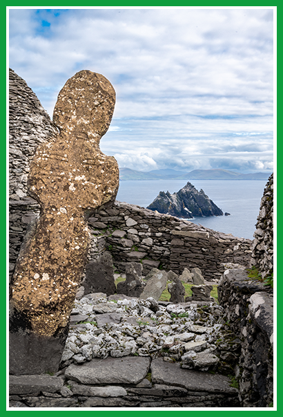 Great cross and cemetery from the early medieval monastery atop Skellig Michael, Ireland, with Little Skellig visible in the distance.