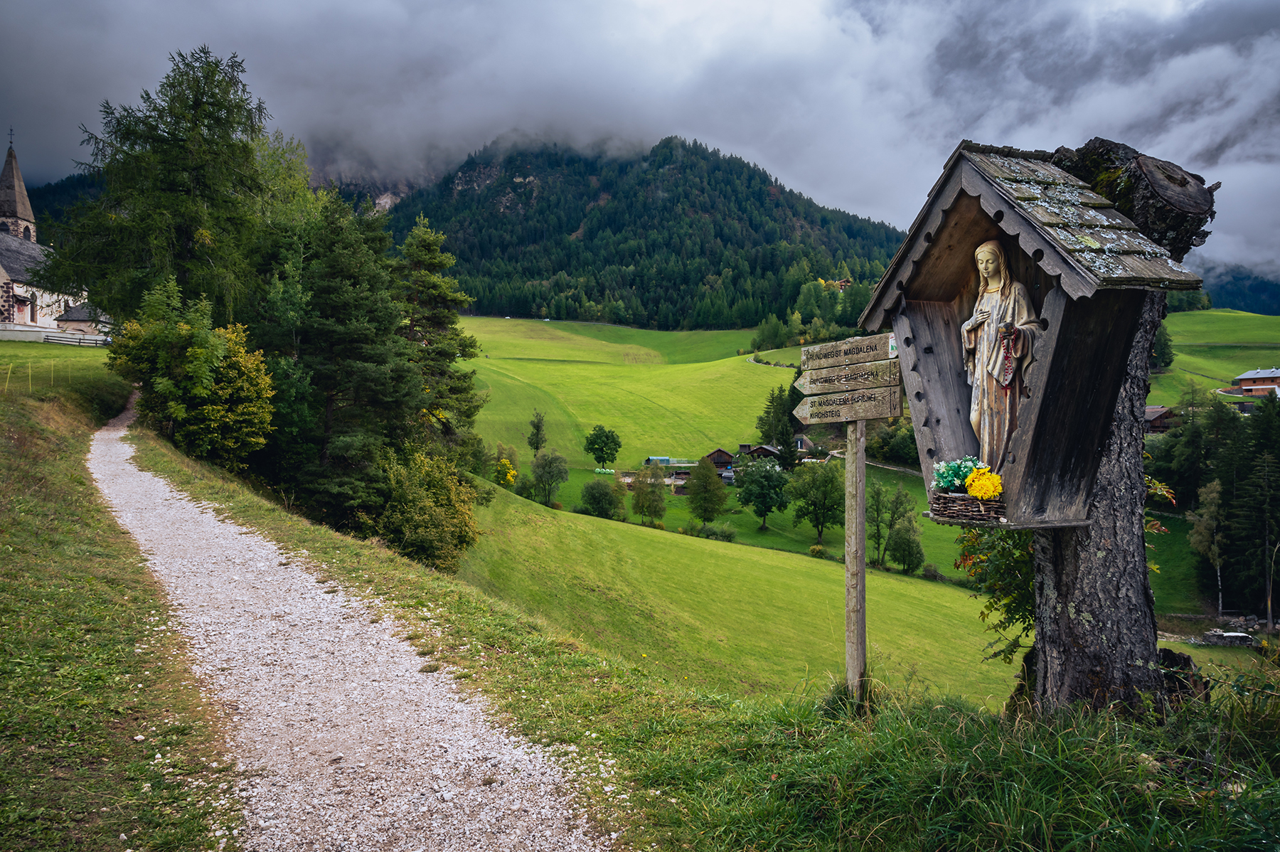 green path with a Madonna shrine, northern Germany