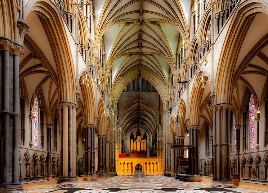 Nave of Lincoln Cathedral, with floorplan grid stretching across the floor toward the crossing.