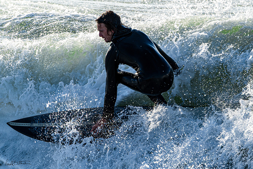 surfer riding the crest of a wave
