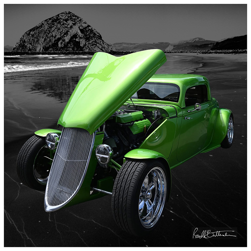 Lime green 1930s car with hood opened to display engine, displayed against a backdrop of Morro Rock, in gray.