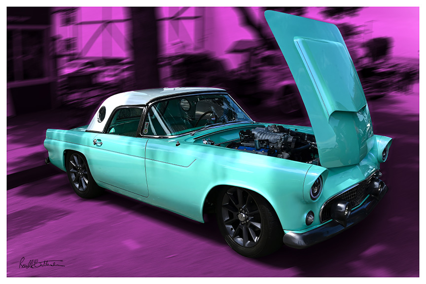 Classic 50s Ford Thunderbird, with hood open to display engine, against a blurred purple backdrop.